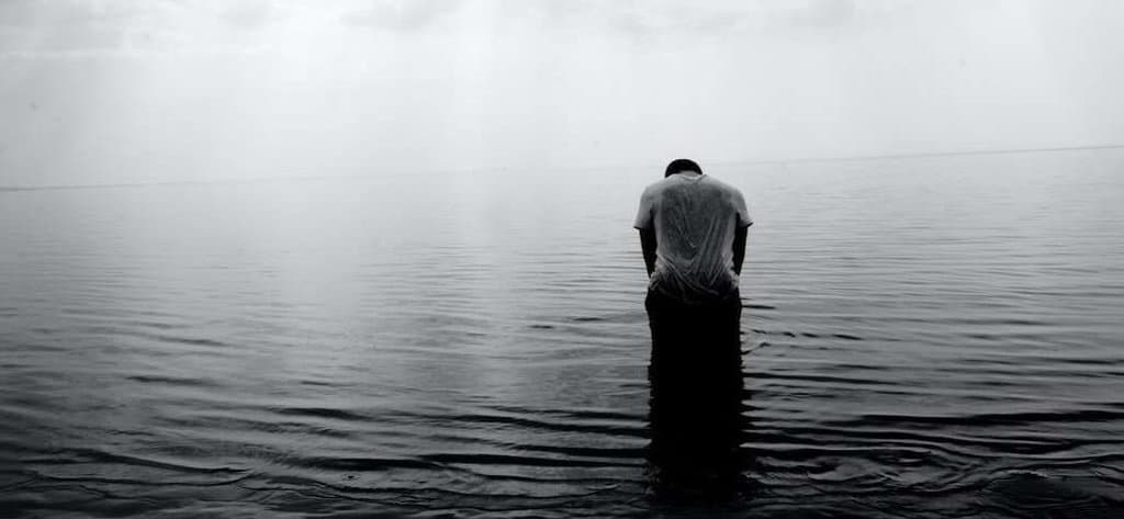 Man sitting in water